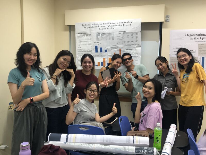 Data Science seminar students pose in front of research posters created with the Epstein Files Database.
