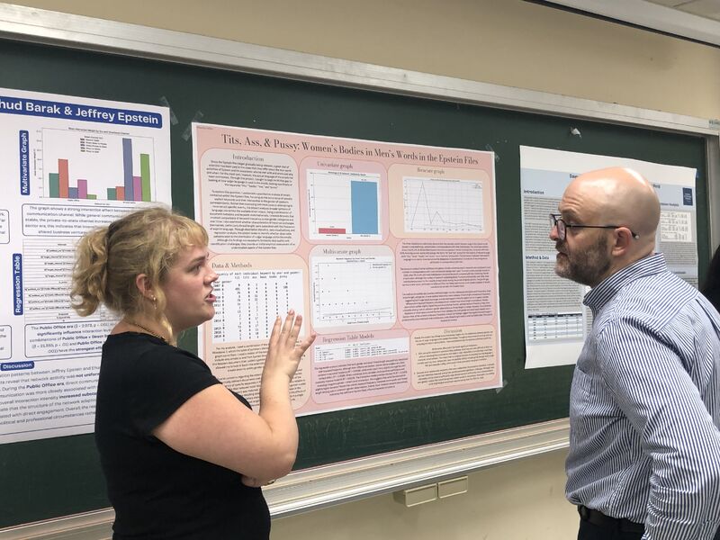 A student discusses a research poster about gendered language in the Epstein files with an instructor.