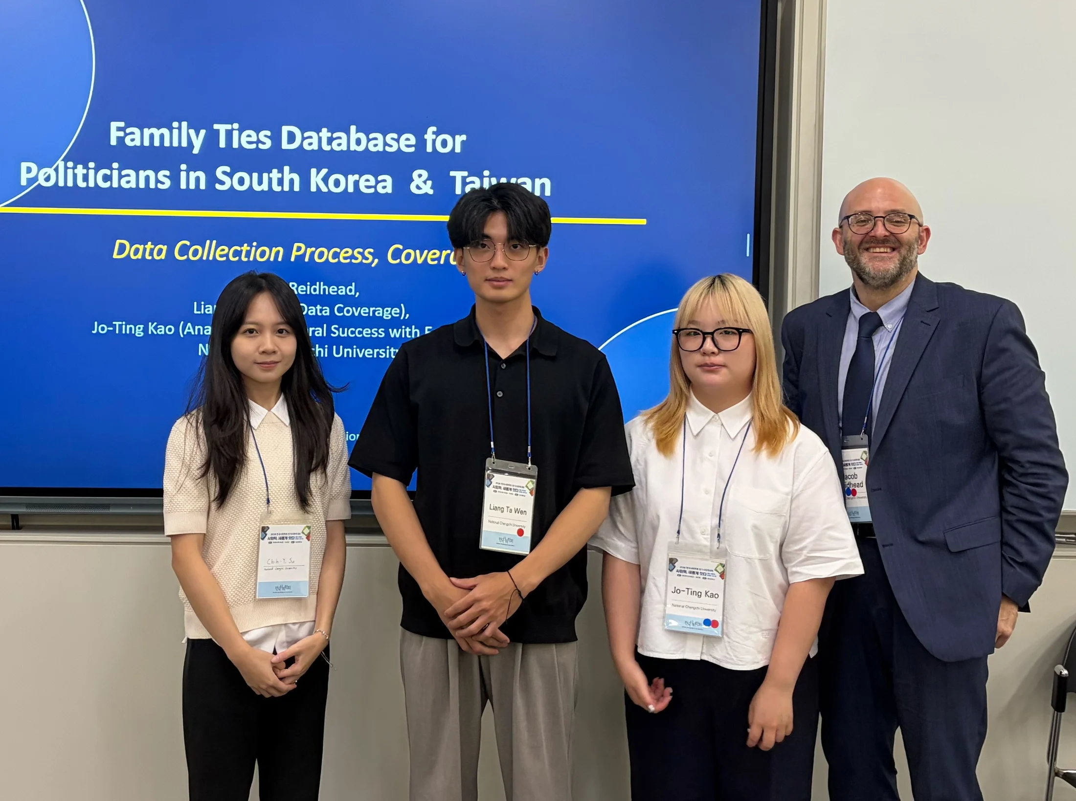 Chih-yi Su, Liang Ta Wen, Jo-ting Ting, and Jacob Reidhead stand in front of the political family ties presentation slide.